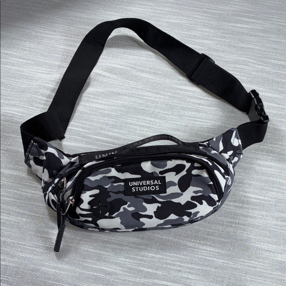 Universal Studios Waistband Bag 
Black and gray camo print used once like new